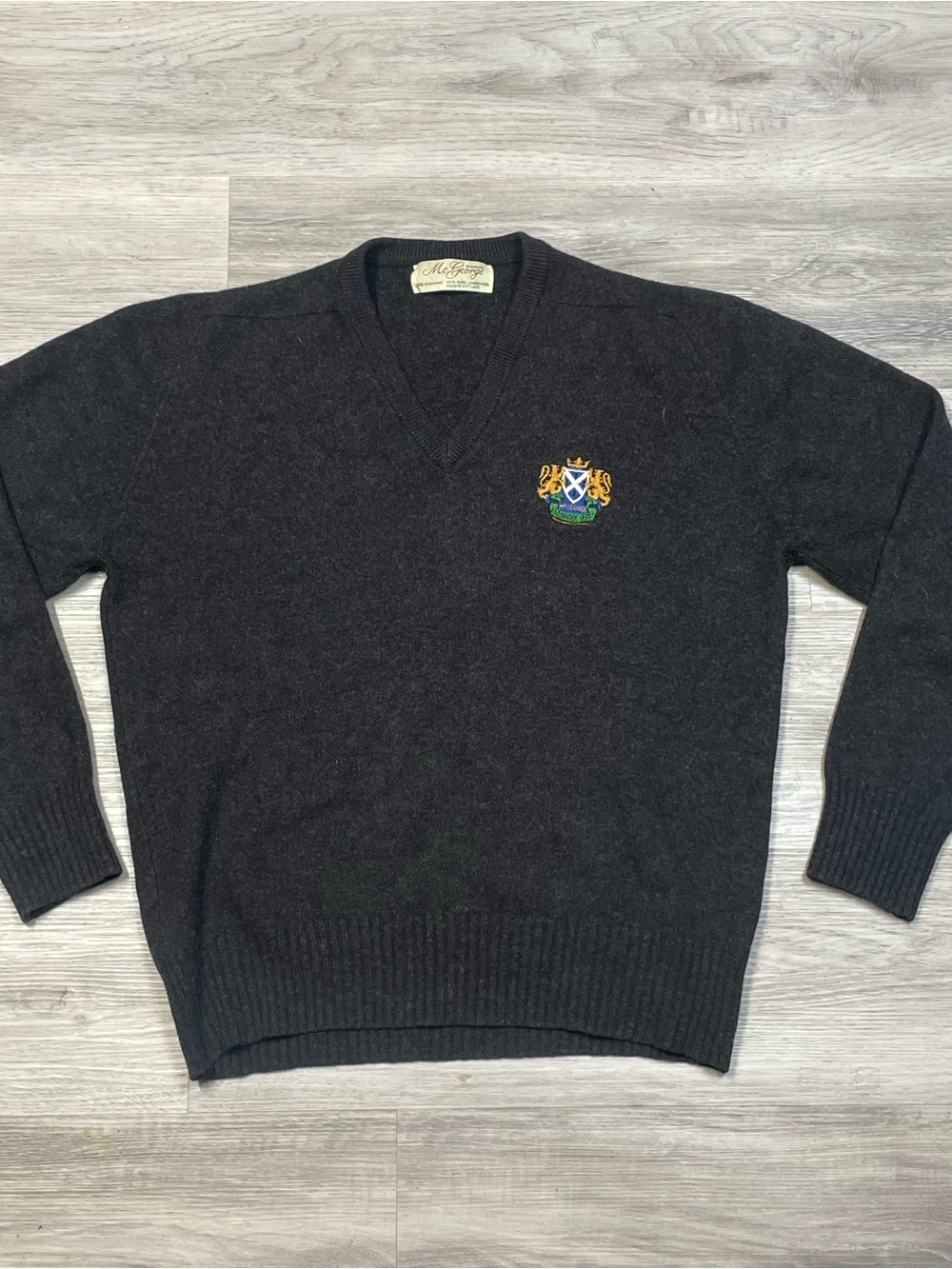 MC George of DumbFries Charcoal V-Neck Sweater with Embroidered Crest